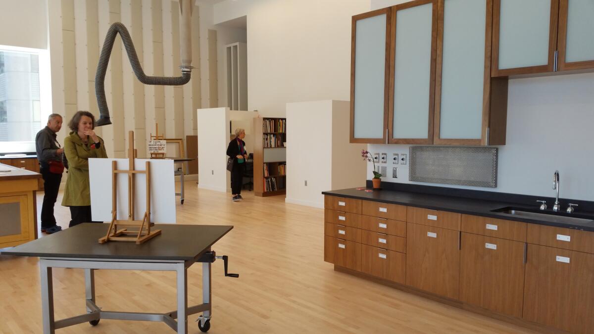 The seventh-story balcony offers views into the museum's sunny new conservation studio. Snohetta partner Craig Dykers said it was important to him to accord comfortable spaces to the museum's workers as well as the public.