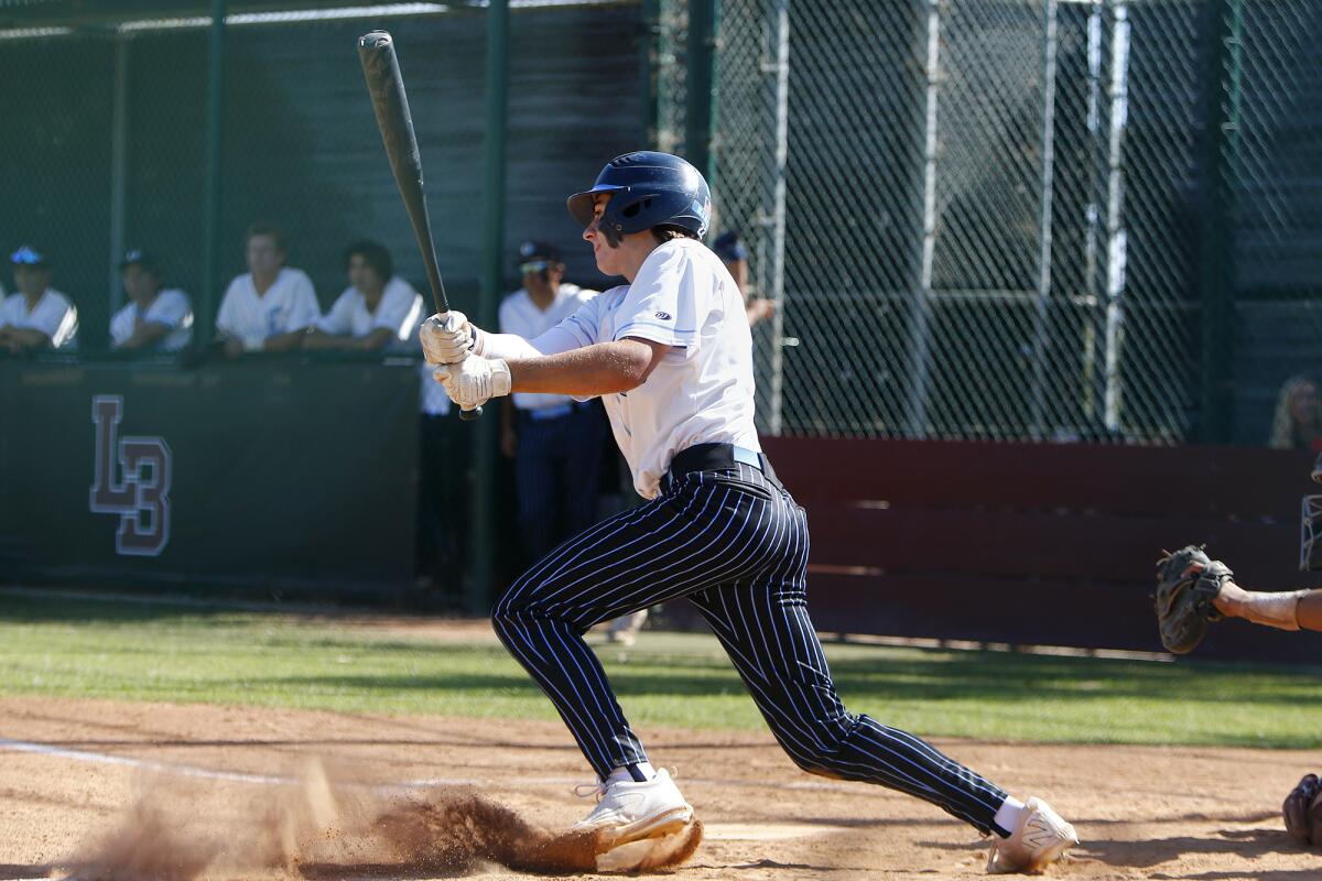 Corona del Mar's Dillon Gomez drives in a runner against Laguna Beach during the second inning in a Wave League game.