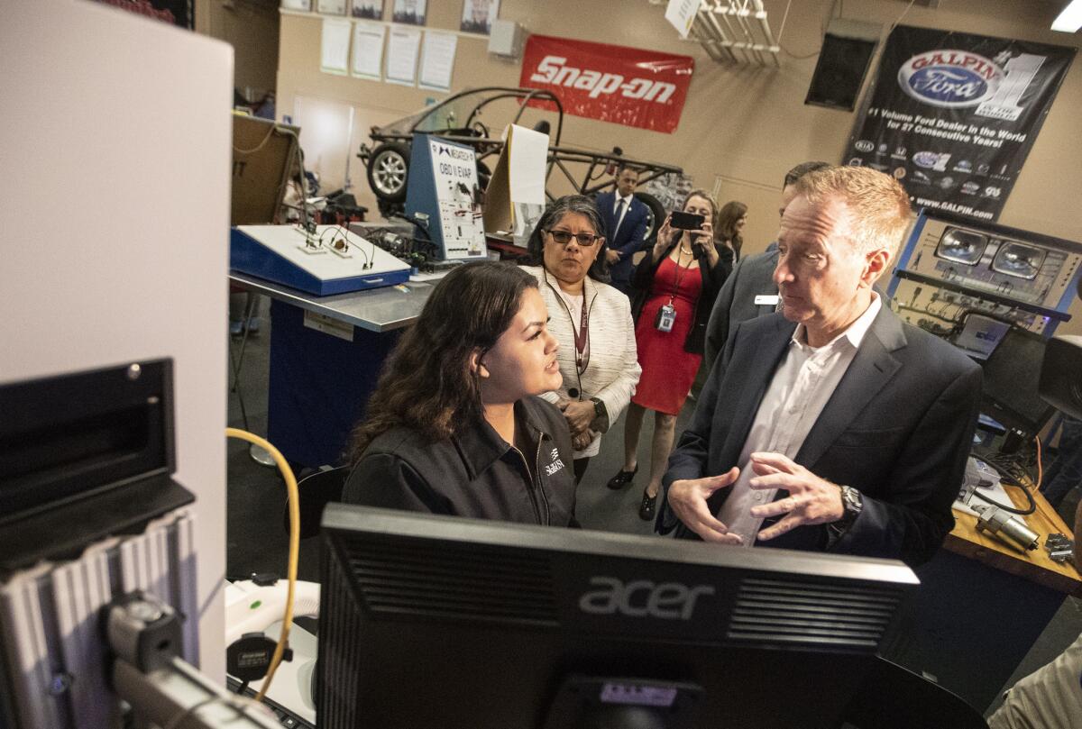 L.A. Unified School District Supt. Austin Beutner visits with Julia Melero, 17, at Van Nuys High in Los Angeles in May 2018.