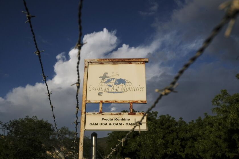 Photo shows a sign outside Christian Aid Ministries in Titanyen, Haiti