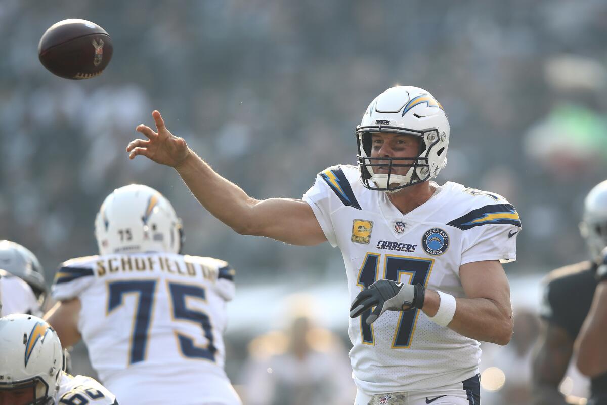 Philip Rivers #17 of the Los Angeles Chargers attempts a pass against the Oakland Raiders during their NFL game at Oakland-Alameda County Coliseum on November 11, 2018 in Oakland, California.