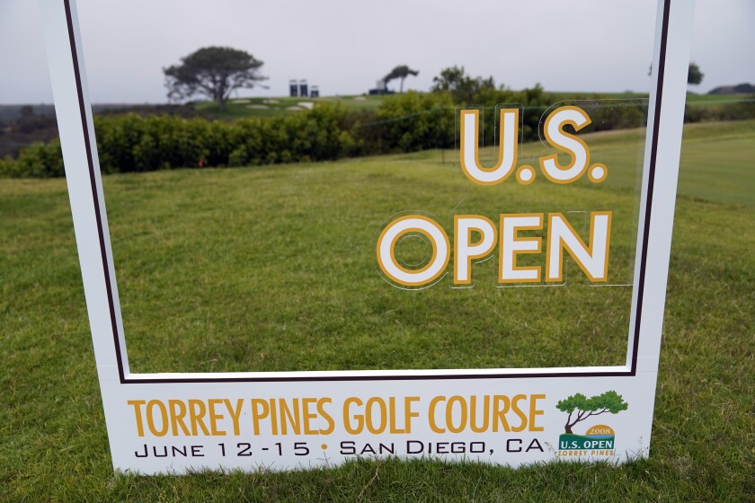 A sign sits along the 16th hole during a practice round of the U.S. Open Golf Championship Monday, June 14, 2021, at Torrey Pines Golf Course in San Diego. (AP Photo/Gregory Bull)