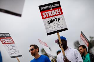 Studio City, CA - May 09: Supporters of the Writer's Guild of America strike, picket along Colfax Avenue, at Radford Studios Center, in Studio City, CA, Tuesday, May 9, 2023. (Jay L. Clendenin / Los Angeles Times)
