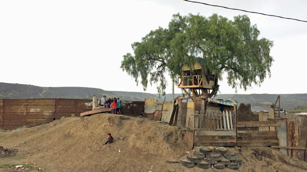 A view of the treehouse built by Japanese art collective Chim Pom on the Tijuana side of the U.S.-Mexico border wall.