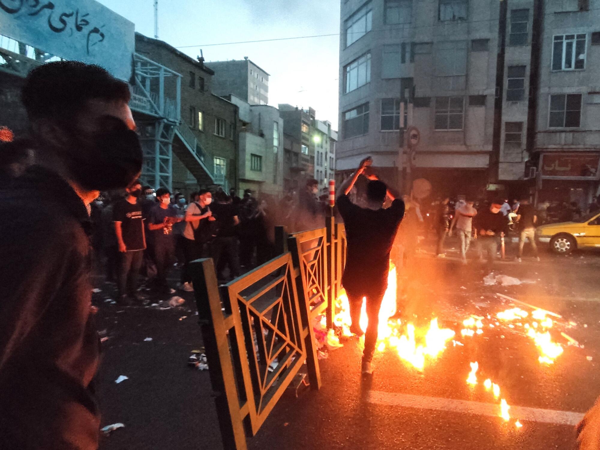 Iranian demonstrators taking to the streets of the capital Tehran