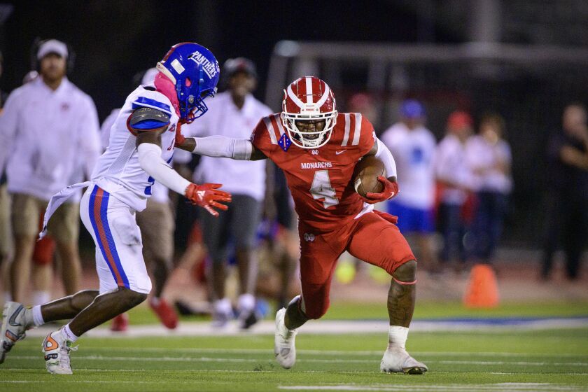 Duncanville, TX - August 27: Mater Dei Monarchs running back Raleek Brown (4) runs for a first down against the Duncanville Panthers during the game in Panther Stadium on Friday, Aug. 27, 2021 in Duncanville, TX. (Jerome Miron / For the LA Times)