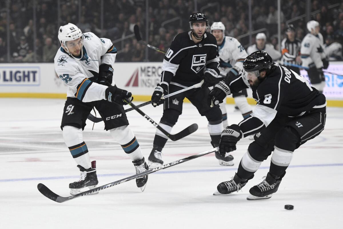 Sharks right wing Kevin Labanc puts a shot on net in front of Kings defenseman Drew Doughty during a game Nov. 25 at Staples Center. 