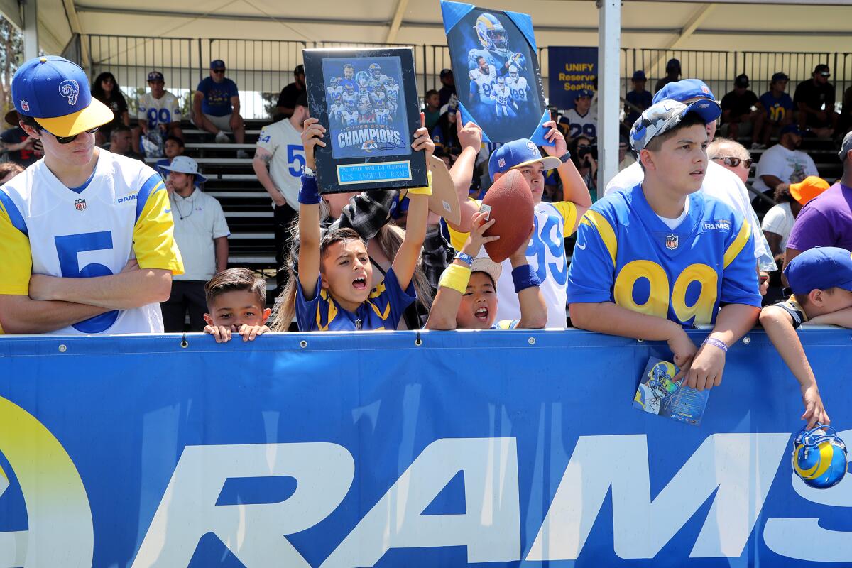 Fans call out to players during the first open practice of Los Angeles Rams training camp on Friday.