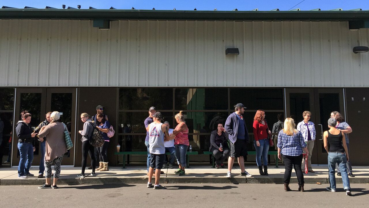 People wait for information at the local fairgrounds after a deadly shooting at Umpqua Community College, in Roseburg, Ore., on Oct. 1.