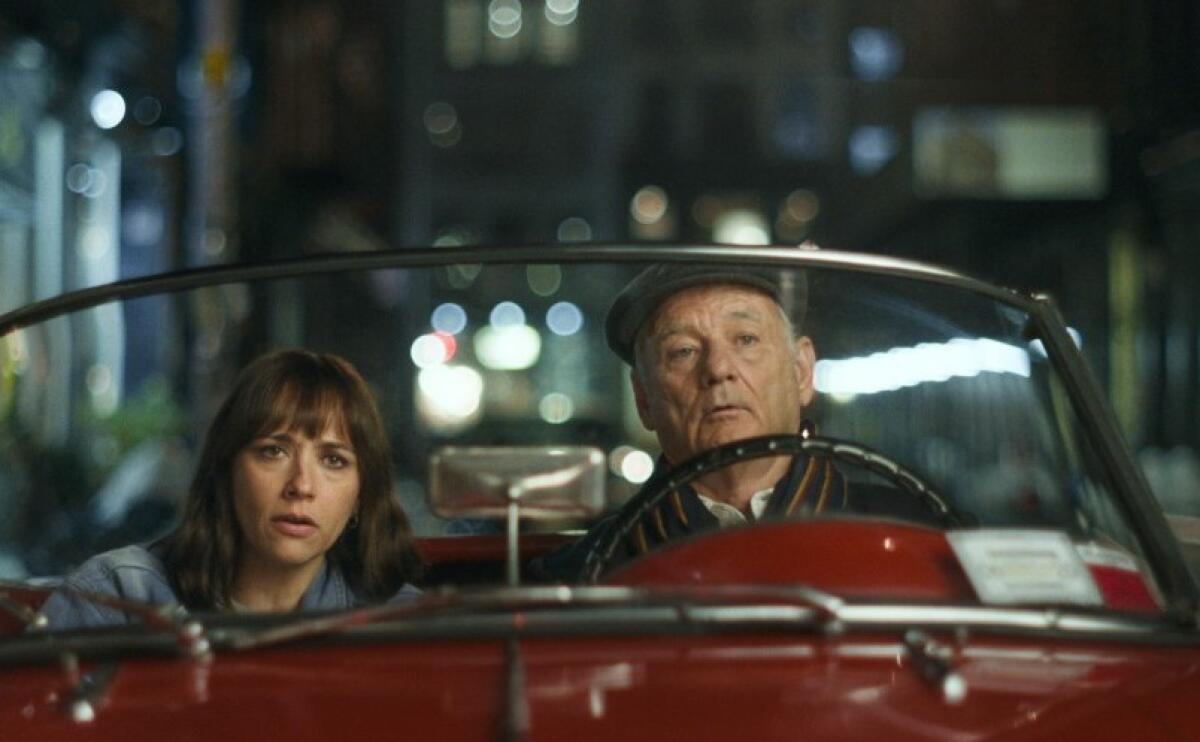 Rashida Jones and Bill Murray drive through New York in a scene from “On the Rocks.”