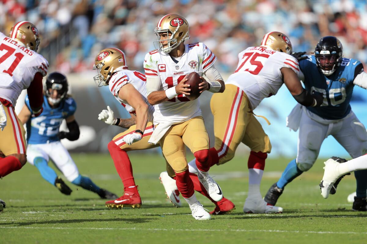 San Francisco 49ers quarterback Jimmy Garoppolo rolls out against the Jacksonville Jaguars.