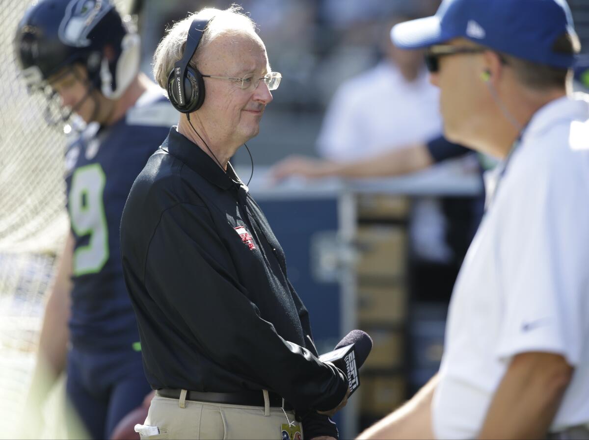 John Clayton stands on the sideline during a game between the Seattle Seahawks and the San Francisco 49ers.