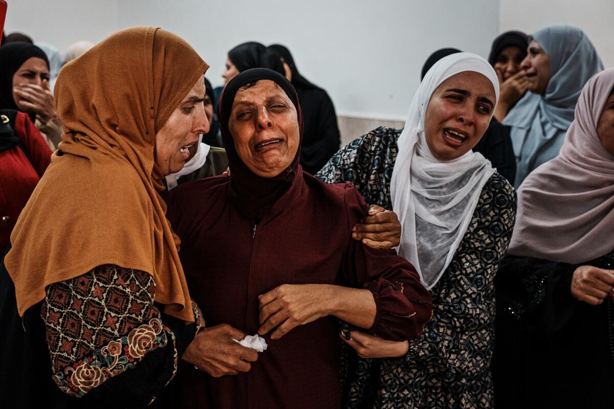 Women weeping over death of young man