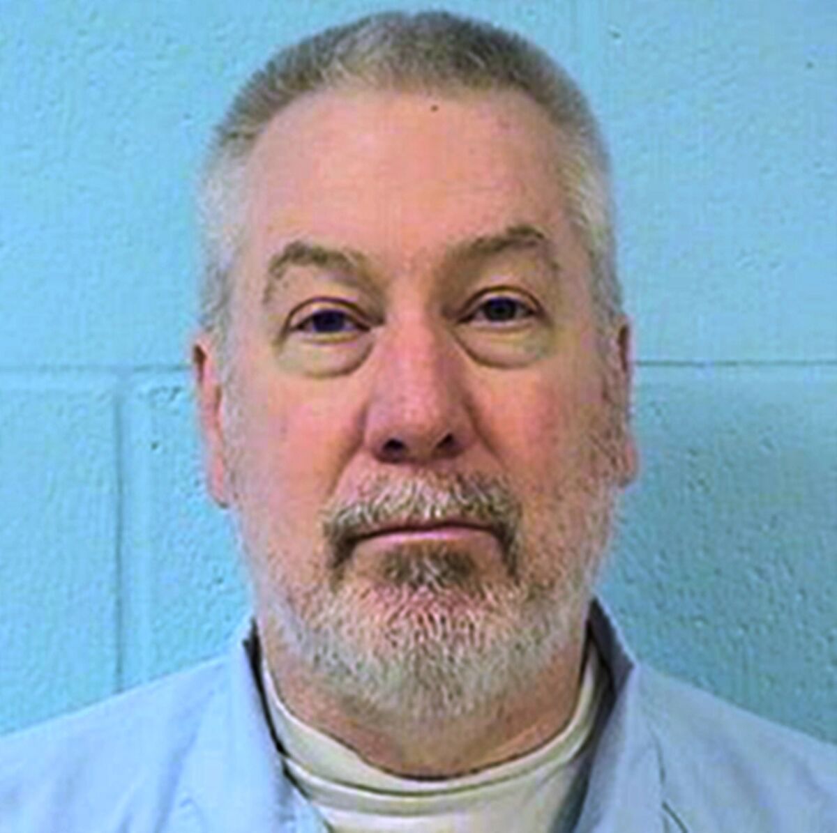 FILE - This undated file photo provided by the Illinois Department of Corrections shows former Bolingbrook, Ill., police officer Drew Peterson. A hearing on a motion seeking to dismiss former Chicago-area police sergeant Peterson's 2012 conviction for killing his third wife has been delayed. The Will County Circuit Court Clerk's office says the hearing originally scheduled for this Friday, Jan. 20, 2022, will be held Feb. 7. (Illinois Department of Corrections via AP, File)