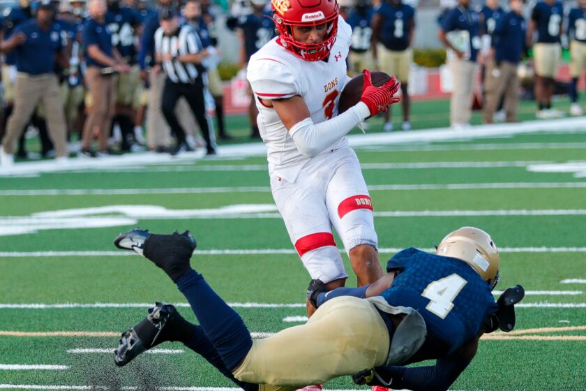 Marcus Ratcliffe of the Cathedral Catholic Dons with a touchdown reception against Mater Dei Catholic.