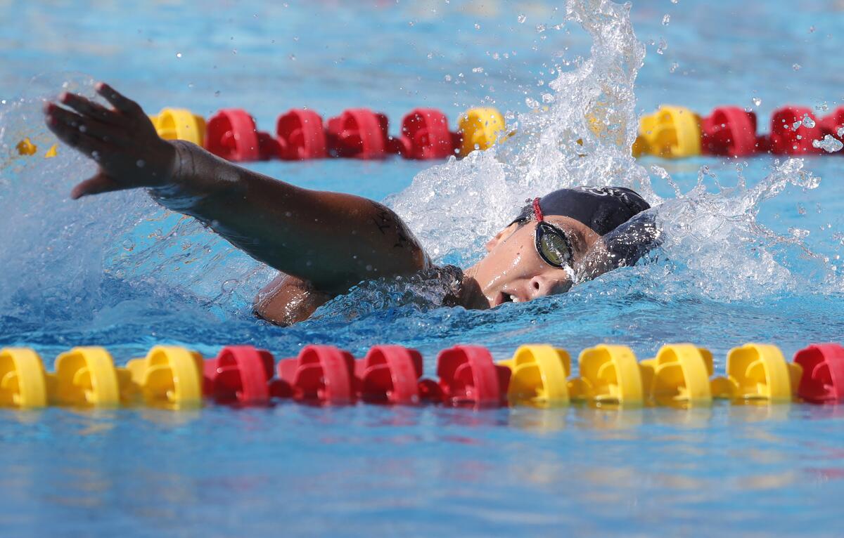 Laguna Beach's Jordan Schneider swims in the girls' 500-yard freestyle in the Wave League swimming finals on Friday.