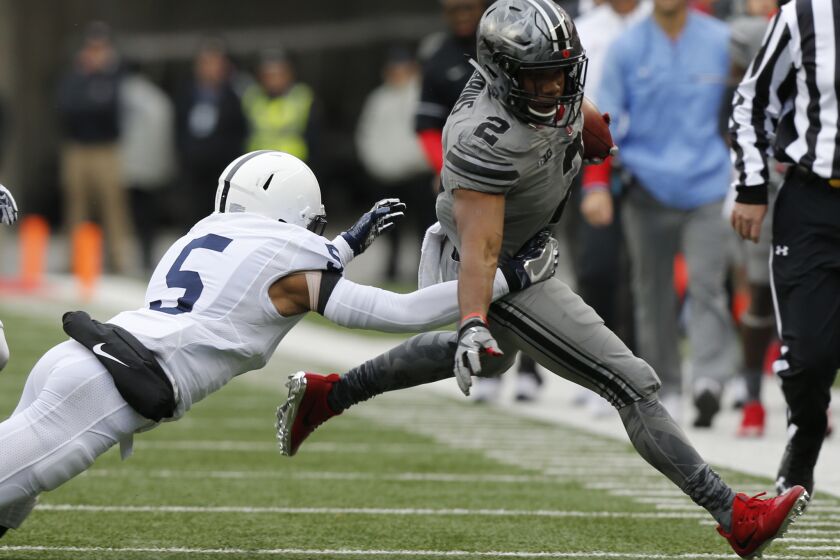Penn State defensive back Tariq Castro-Fields, left, forces Ohio State running back J.K. Dobbins out of bounds during the first half of an NCAA college football game Saturday, Oct. 28, 2017, in Columbus, Ohio. (AP Photo/Jay LaPrete)