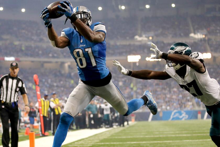 Lions receiver Calvin Johnson beats Eagles cornerback Malcolm Jenkins for a touchdown reception in the third quarter Thursday.