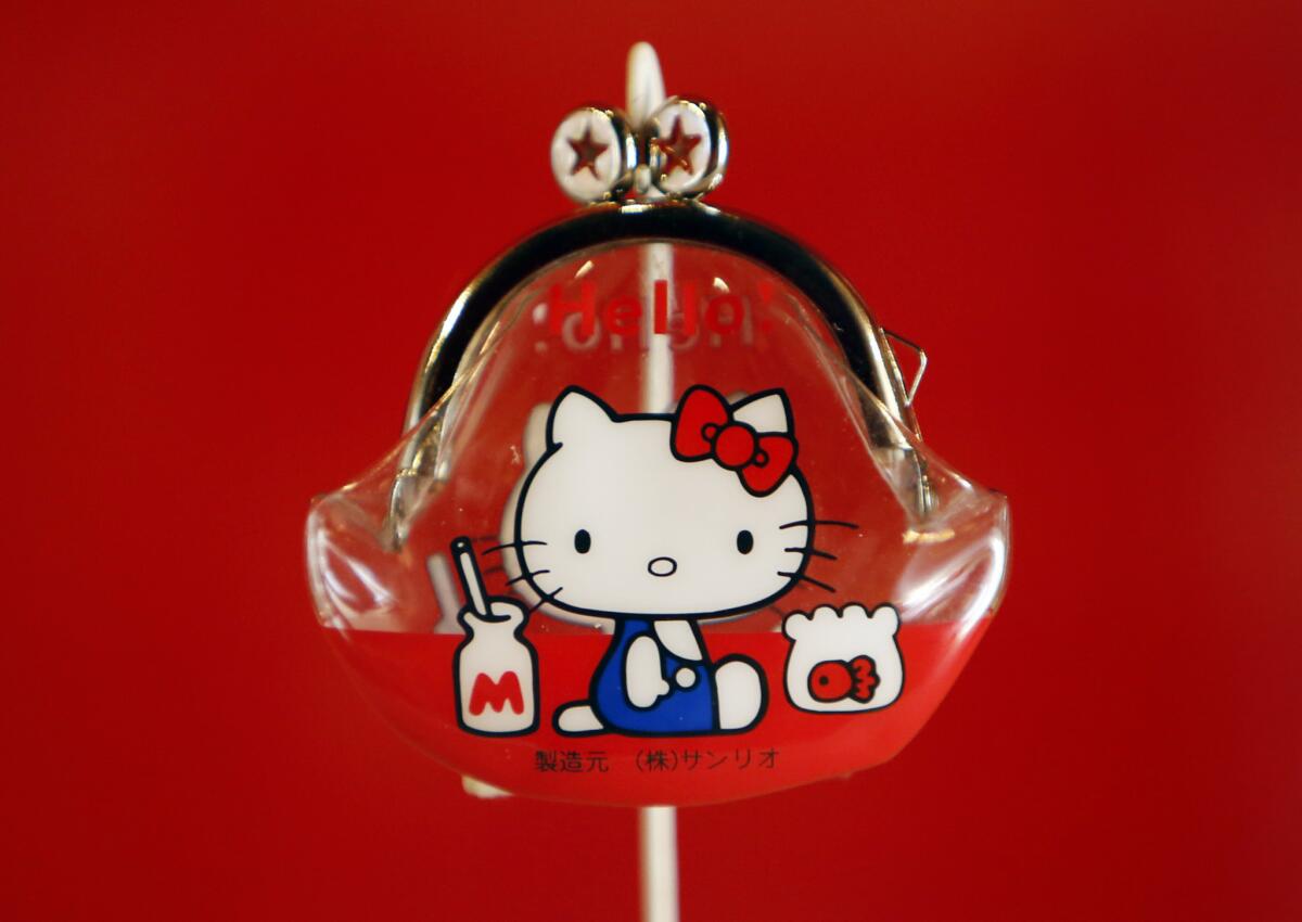 The 1974 coin purse that launched the Hello Kitty empire is shown. Now the pop icon will appear at new concept stores planned at Universal theme parks in Orlando, Fla., and Hollywood.