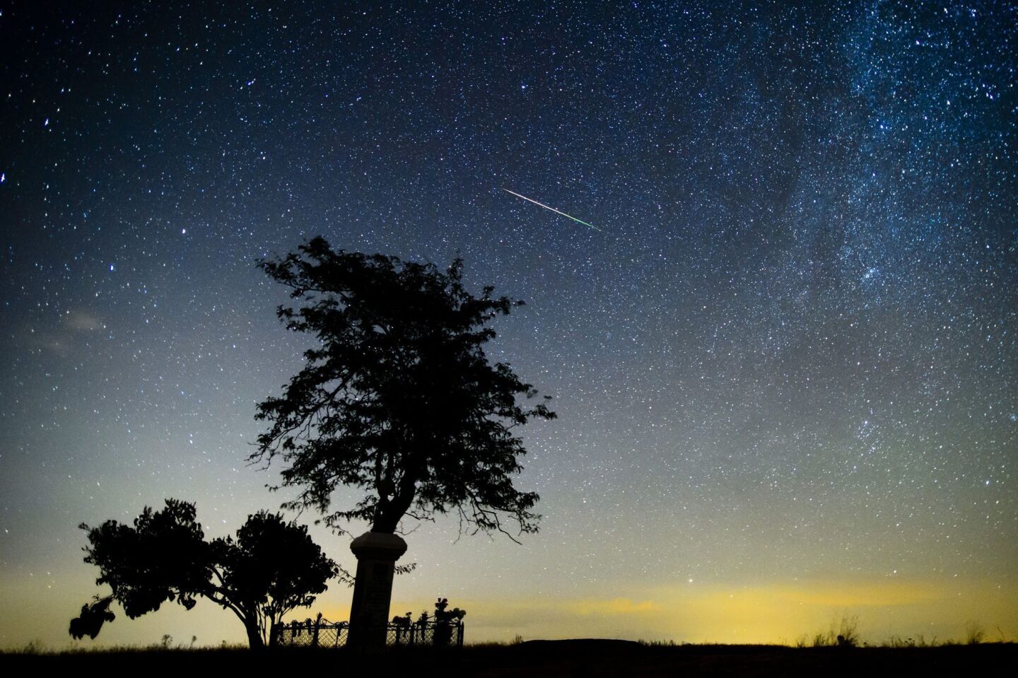 A shooting star of the Perseid meteor shower burns up in the atmosphere near Salgotarjan, northeast of Budapest.