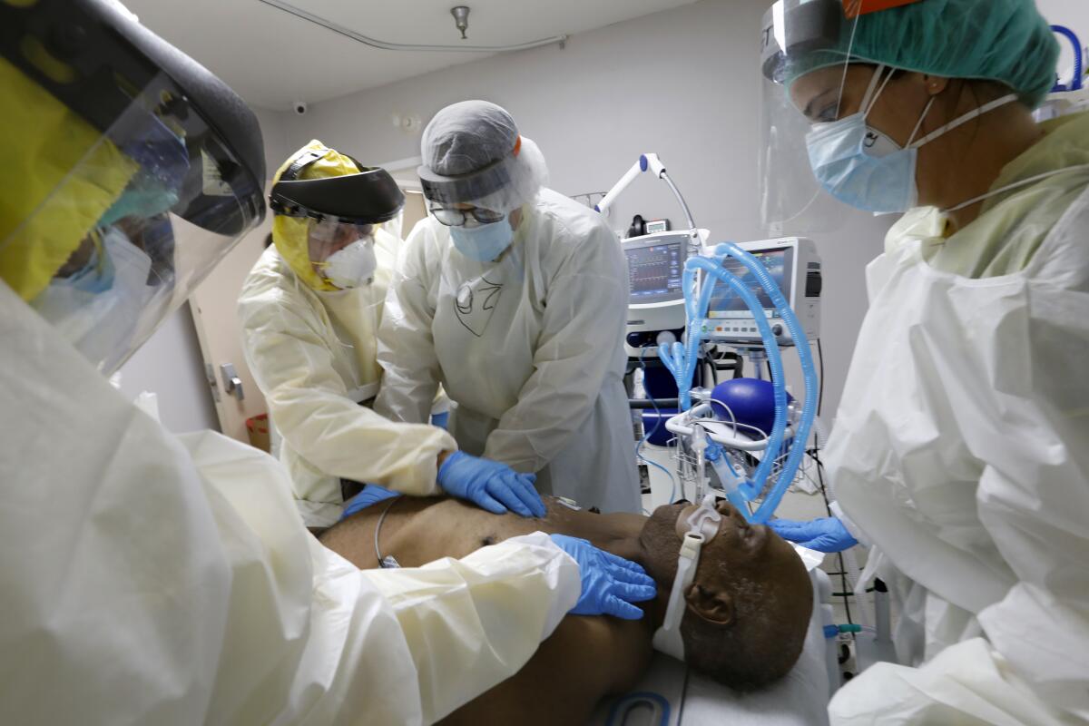 A team at United Memorial Medical Center in Houston attempts to resuscitate a COVID-19 patient.