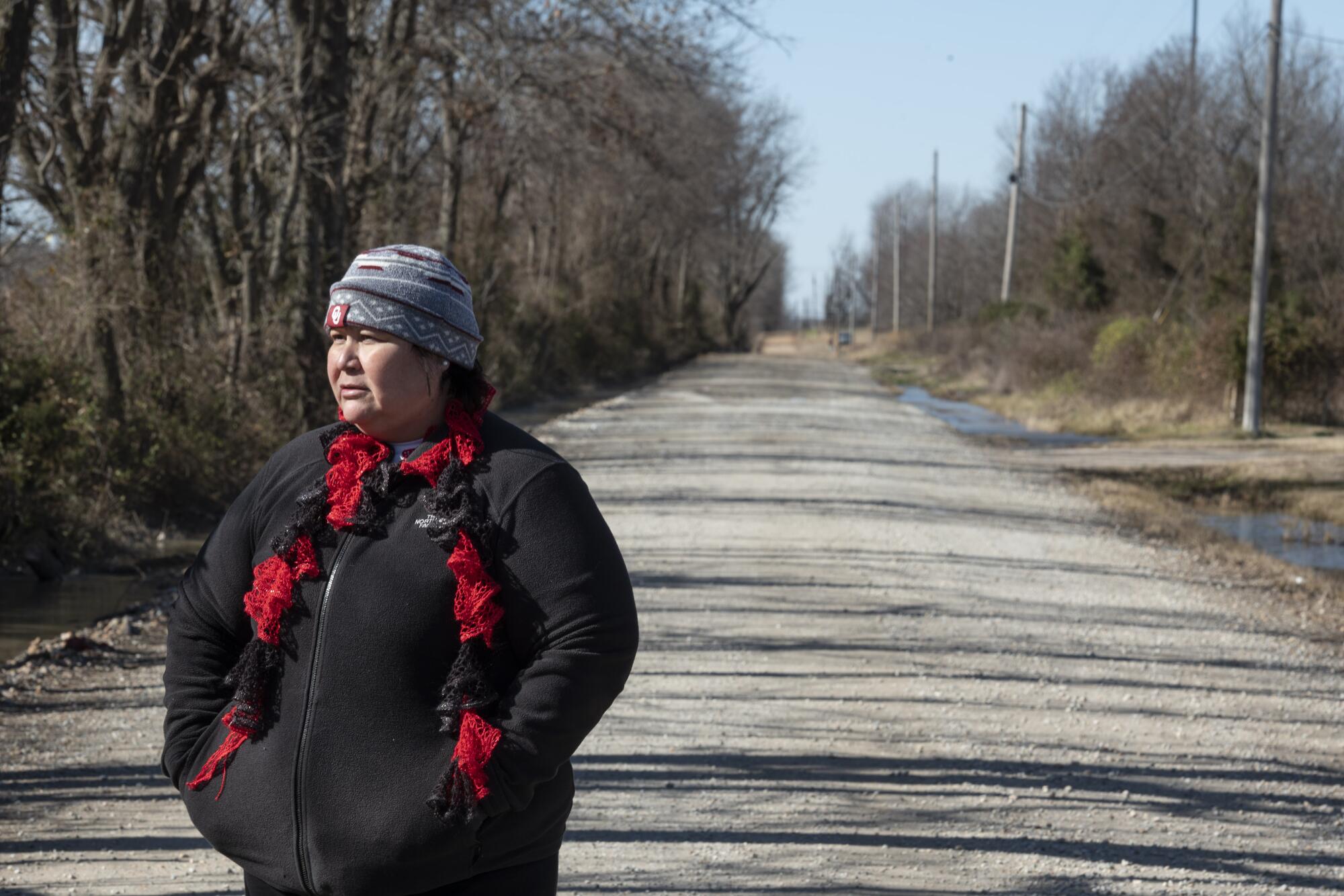Pam Smith on a dirt road near the area where her niece, Aubrey Dameron, was last seen in March.