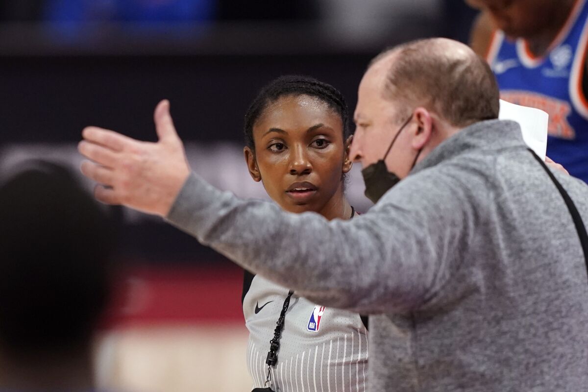 FILE - New York Knicks head coach Tom Thibodeau argues a call with referee Danielle Scott during the second half of an NBA basketball game against the Detroit Pistons in Detroit, in this Sunday, Feb. 28, 2021, file photo. The NBA announced the hiring of three referees Monday, Oct. 18, 2021, including Danielle Scott, who becomes the sixth woman on the full-time staff.(AP Photo/Carlos Osorio, File)