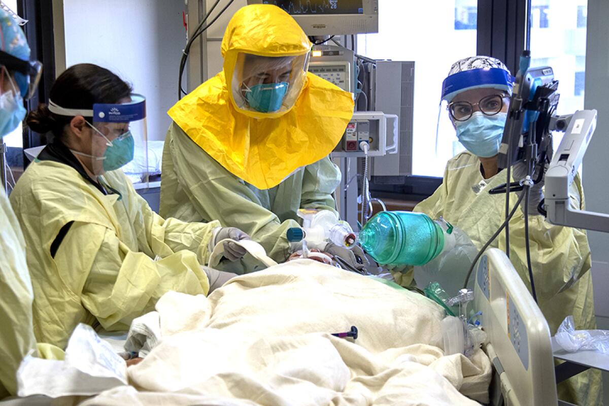 A COVID-19 patient is treated in the ICU at Loma Linda University Medical Center.