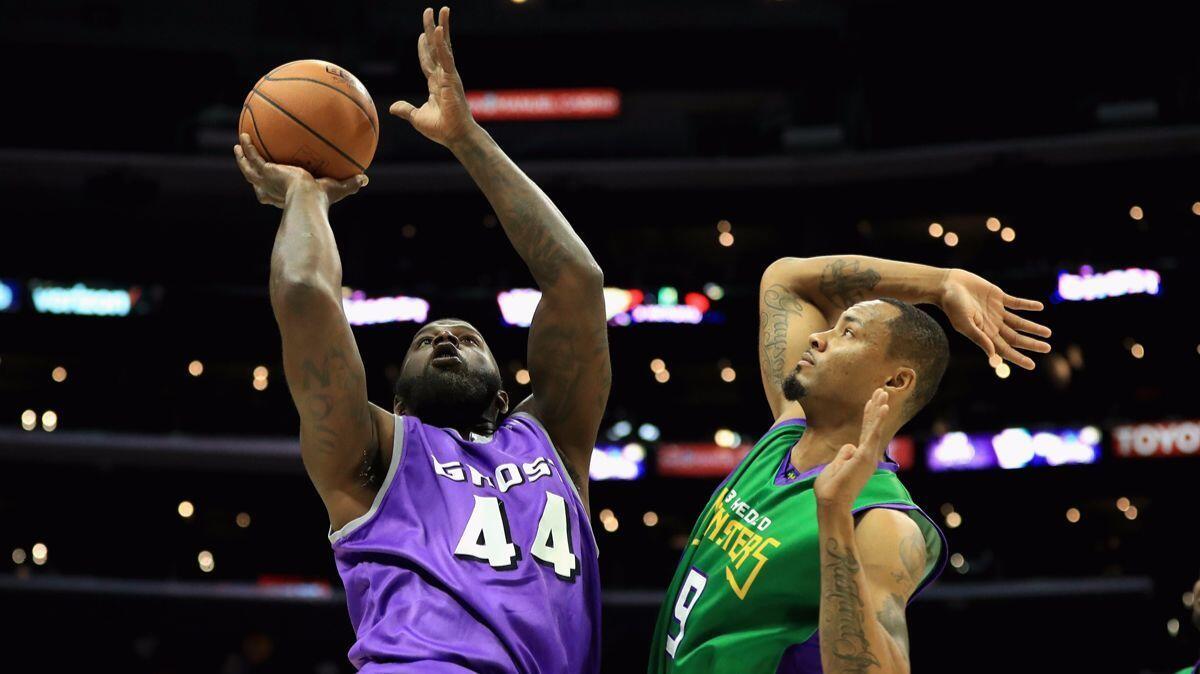 Ghost Ballers' Ivan Johnson (44) drives past 3 Headed Monsters' Rashard Lewis (9) during week eight of the BIG3 league at Staples Center on Sunday.
