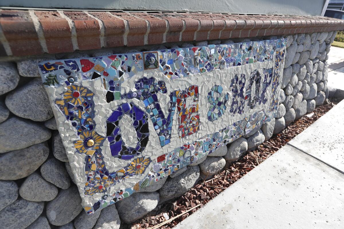 A tile message adorns a path outside at one of Waymakers' youth shelters.