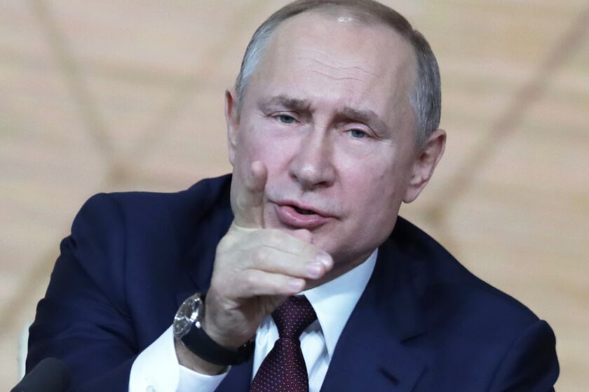 Russian President Vladimir Putin gestures during his annual news conference in Moscow, Russia, Thursday, Dec. 19, 2019. Russian President Vladimir Putin called the U.S. impeachment process "far-fetched" Thursday, making a seemingly obvious prediction that Donald Trump will be acquitted in the Senate. (AP Photo/Pavel Golovkin)