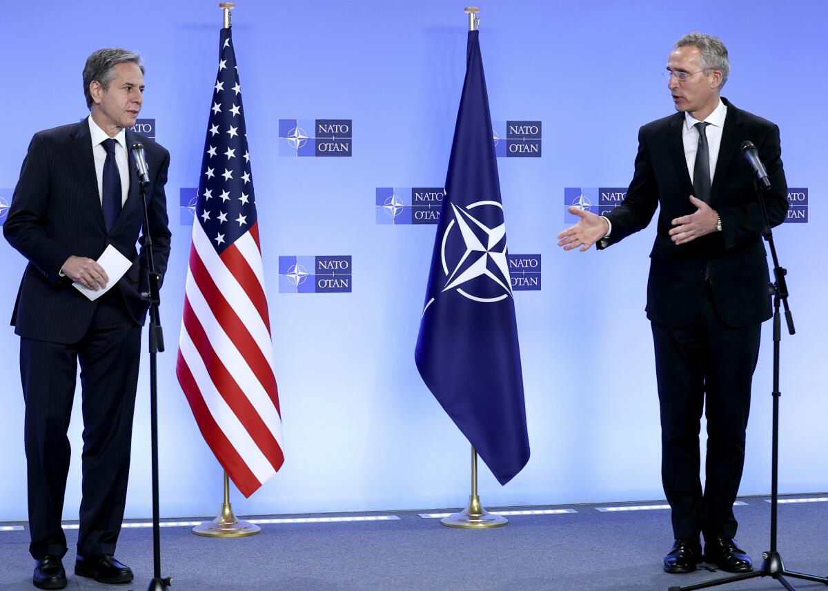 NATO Secretary General Jens Stoltenberg, right, and United States Secretary of State Antony Blinken address a media conference at NATO headquarters in Brussels, Wednesday, April 14, 2021. United States Secretary of State Antony Blinken is in Brussels on Wednesday for talks with European and NATO allies about Afghanistan, Ukraine and other matters. (Kenzo Tribouillard, Pool via AP)