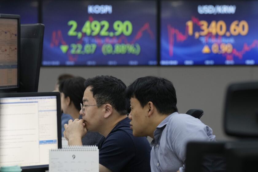 Currency traders watch monitors at the foreign exchange dealing room of the KEB Hana Bank headquarters in Seoul, South Korea, Friday, Sept. 22, 2023. Asian shares were mixed on Friday after another slump on Wall Street driven by expectations that U.S. interest rates will stay high well into next year. (AP Photo/Ahn Young-joon)