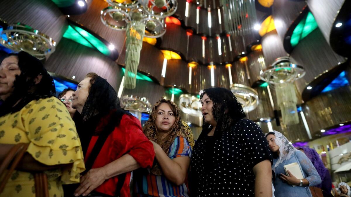 Women exit La Luz del Mundo church’s flagship temple in Guadalajara in June.