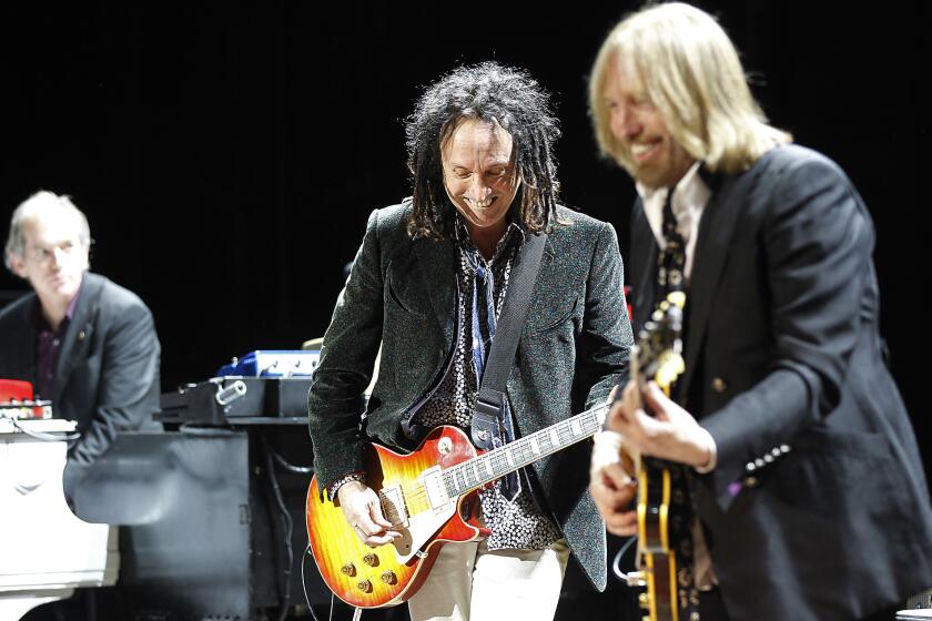 Tom Petty, right, and Heartbreakers Benmont Tench, left, and Mike Campbell, shown at a 2011 benefit in Northridge, will play six nights at the Fonda Theatre in Hollywood in June.