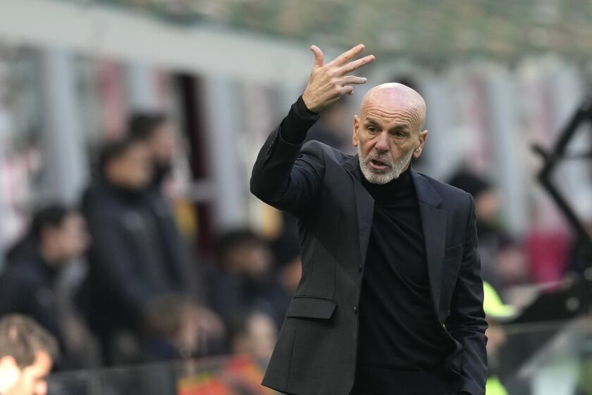 AC Milan's manager Stefano Pioli gives directions to his players during a Serie A soccer match between AC Milan and Sassuolo at the San Siro stadium in Milan, Italy, Sunday, Jan. 29, 2023. (AP Photo/Antonio Calanni)