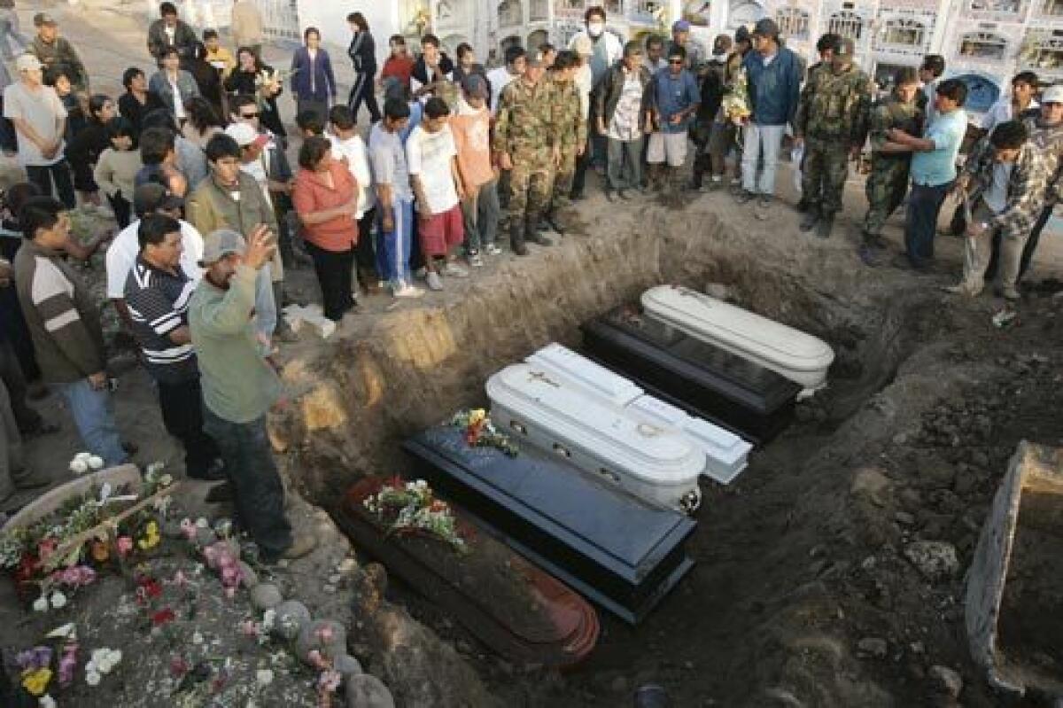 Victims of the 8.0 magnitude earthquake that hit Peru on Wednesday are buried in Pisco, 155 miles south of Lima, the capital. Pisco and surrounding areas accounted for about 70% of the government's tally of the dead.