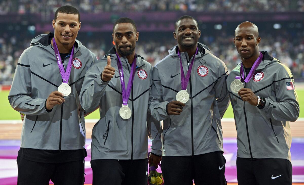 The U.S. men's relay team from the 2012 London Olympic Games was stripped of their silver medals as punishment after Tyson Gay, second from left, tested positive for steroids.