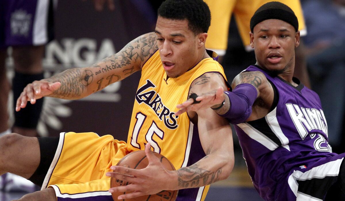Lakers guard Jabari Brown battles Kings guard Ben McLemore for a loose ball during the fourth period at Staples Center.