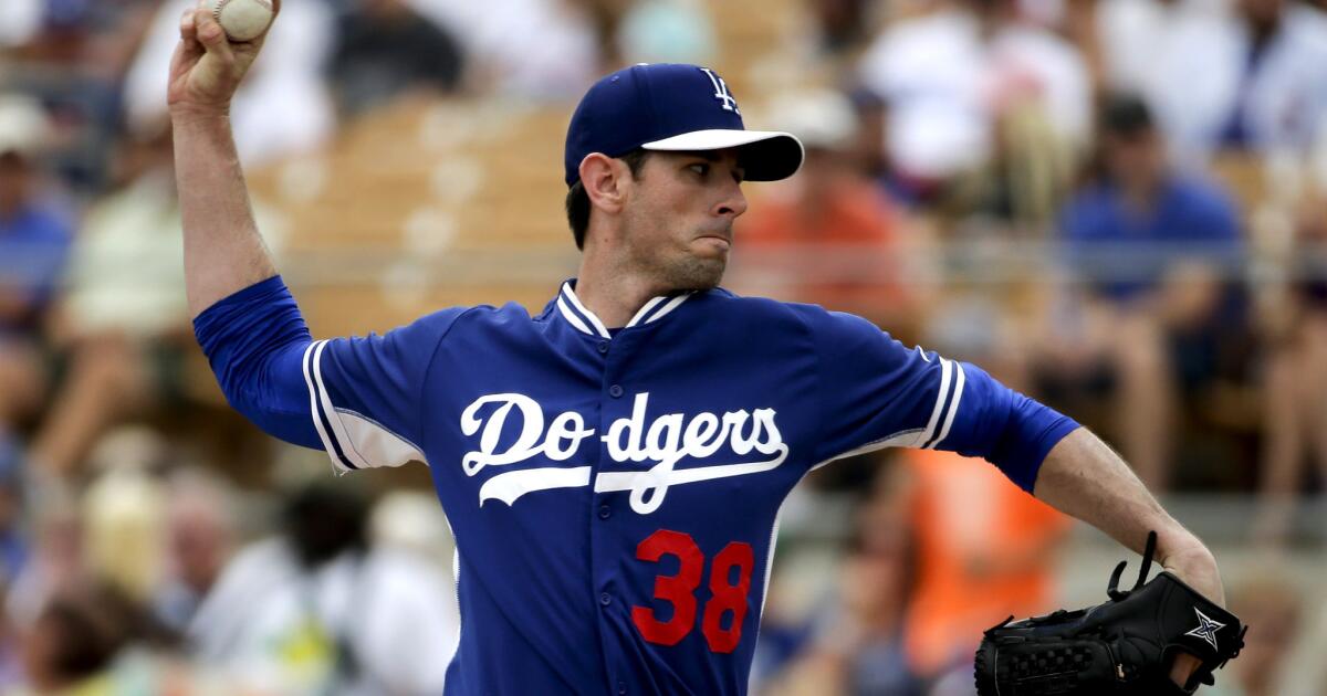 Dodgers pitcher Brandon McCarthy congratulates Blue Jays Josh