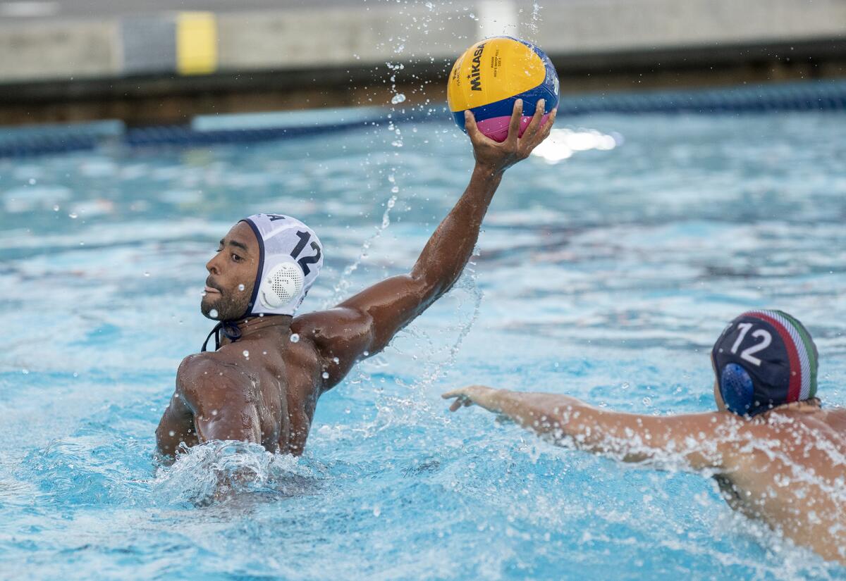 USA Water Polo's Max Irving takes a shot under pressure from Italy's Andrea Mladossich during an exhibition game Tuesday.