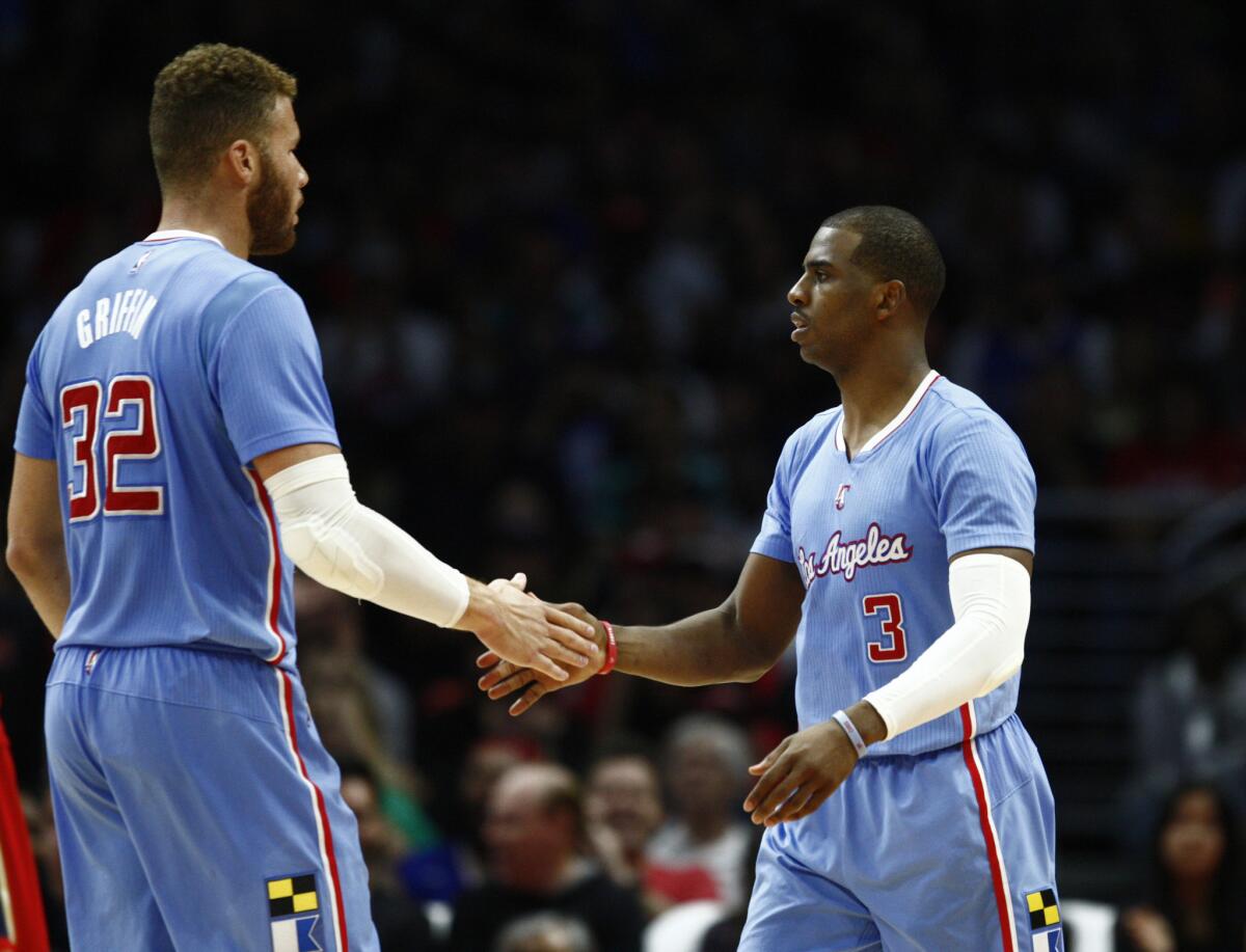 Clippers forward Blake Griffin and guard Chris Paul congratulate each other during a game against the New Orleans Pelicans on March 22.