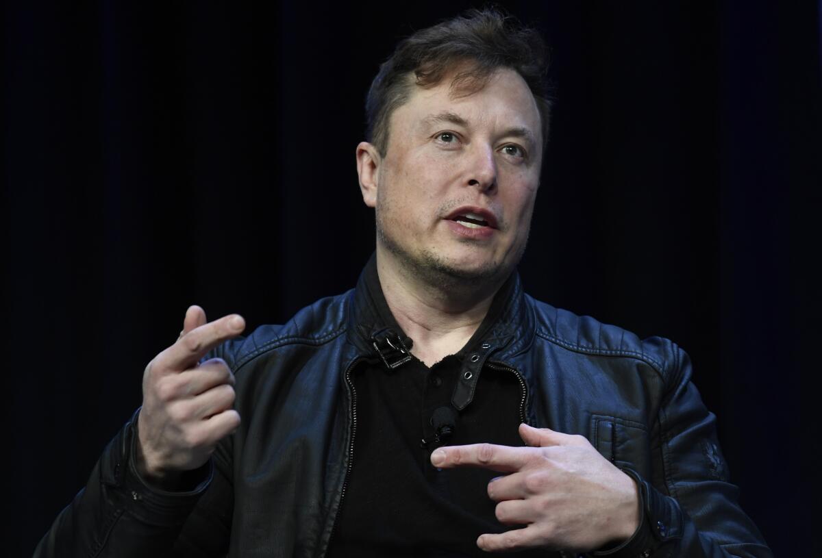 FILE - Tesla and SpaceX Chief Executive Officer Elon Musk speaks at the SATELLITE Conference and Exhibition in Washington, on March 9, 2020. Tesla shares tumbled more than 7% in early trading on Friday, June 3, 2022, on a report that Musk is considering laying off 10% of the electric automakers’ workers. (AP Photo/Susan Walsh, File)