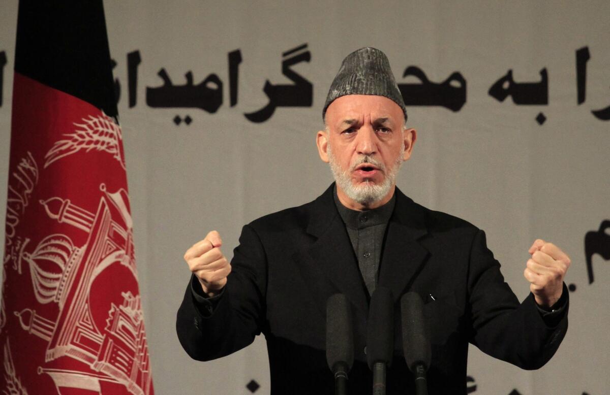 Afghan President Hamid Karzai speaks during an event commemorating International Women's Day, in Kabul, Afghanistan.