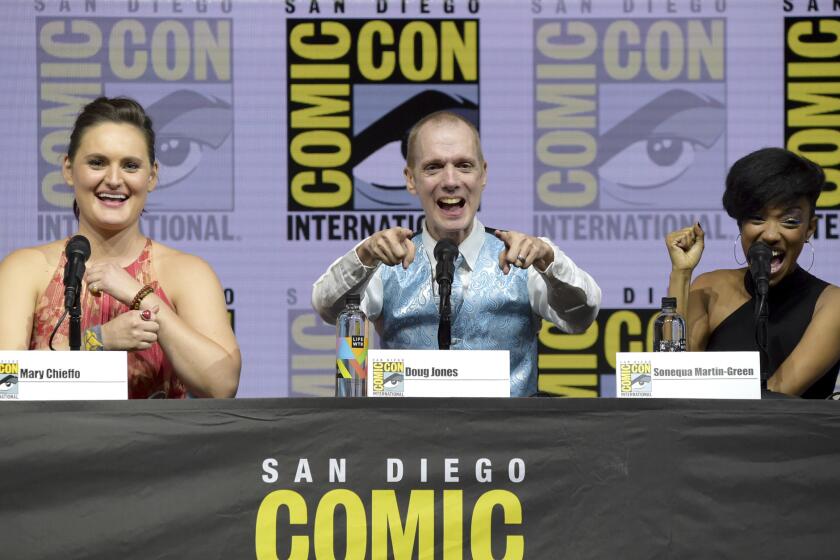 Mary Chieffo, from left, Doug Jones and Sonequa Martin-Green react to the crowd at the "Star Trek: Discovery" panel on day two of Comic-Con International.