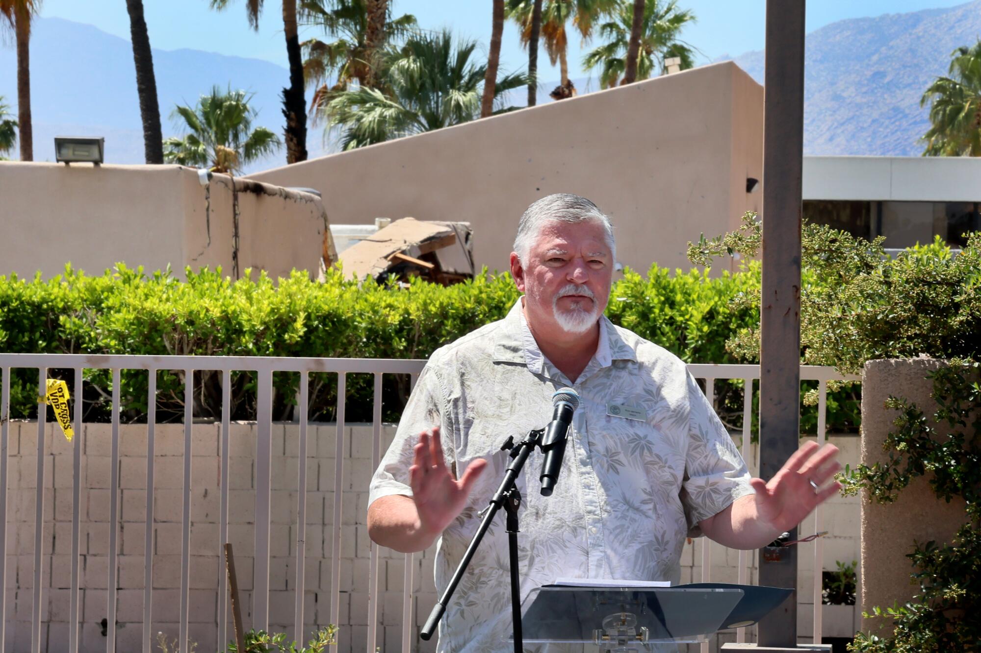 Palm Springs mayor Ron deHarte speaks during an outdoor news conference.