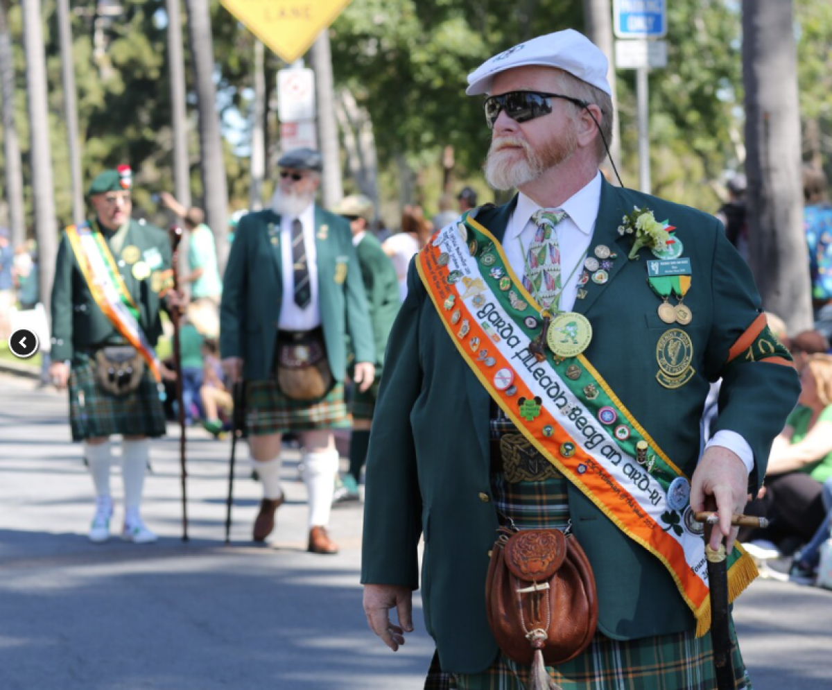 A participant walks in a previous edition of the St. Patrick's Day Parade in Balboa Park.
