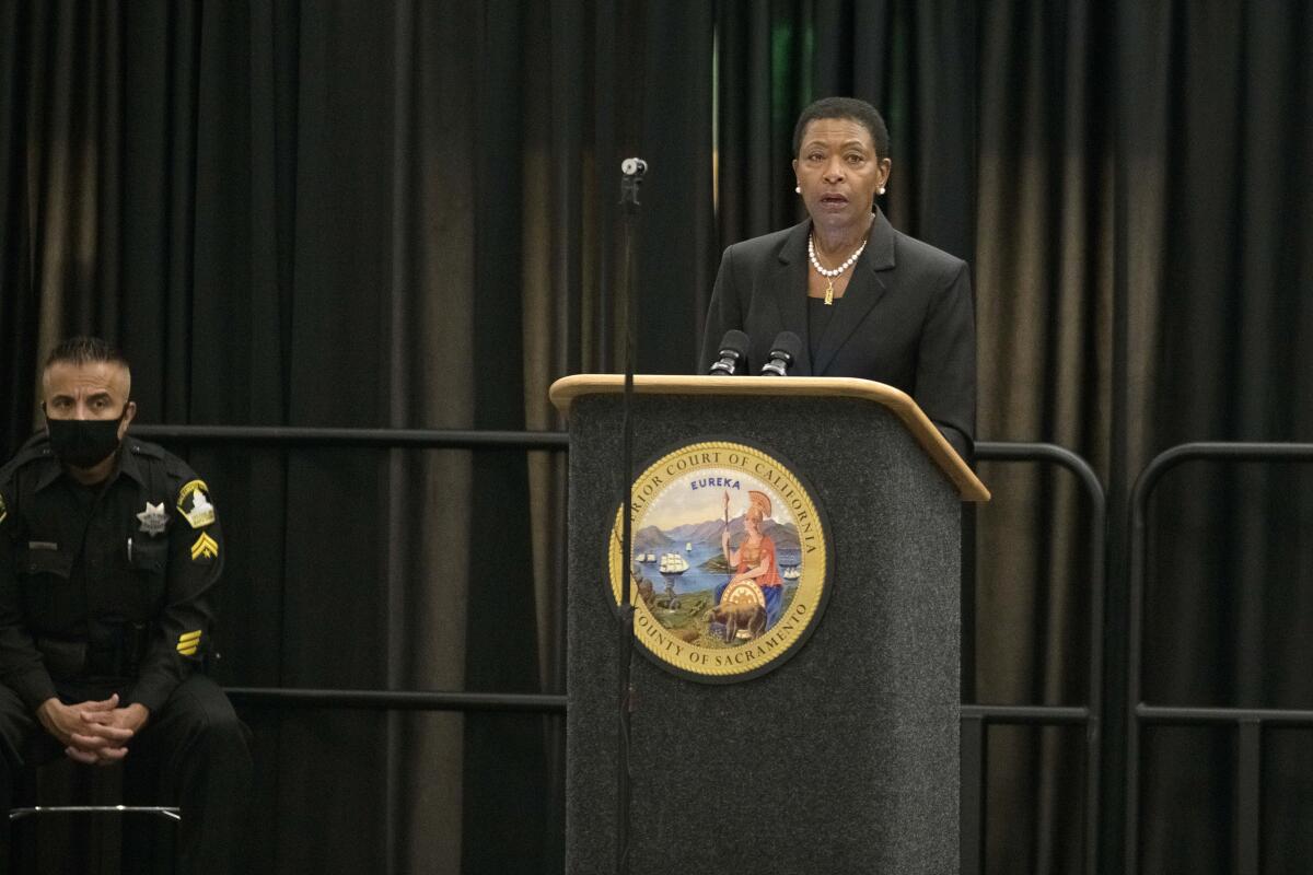 Diana Becton speaks at a podium.