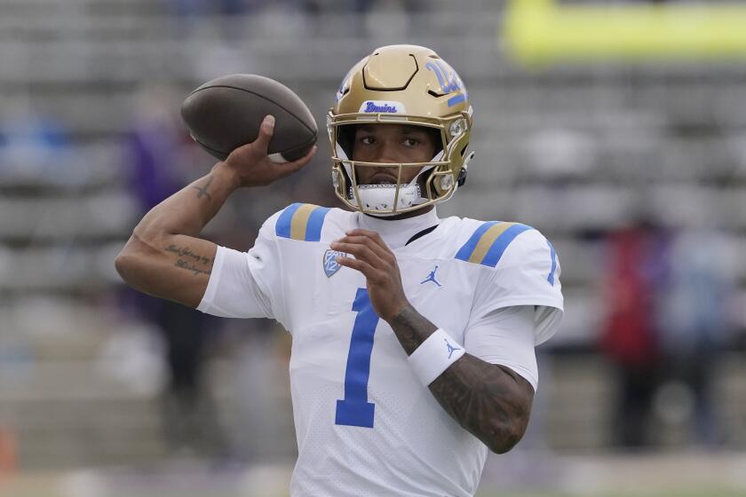 UCLA quarterback Dorian Thompson-Robinson passes during warmups before an NCAA college football game against Washington, Saturday, Oct. 16, 2021, in Seattle. (AP Photo/Ted S. Warren)