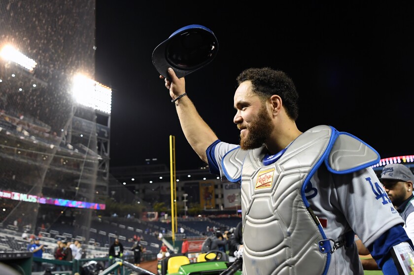 Dodgers catcher Russell Martin acknowledges Dodger fans at Nationals Park following the team’s victory in Game 3 of the NLDS on Sunday.